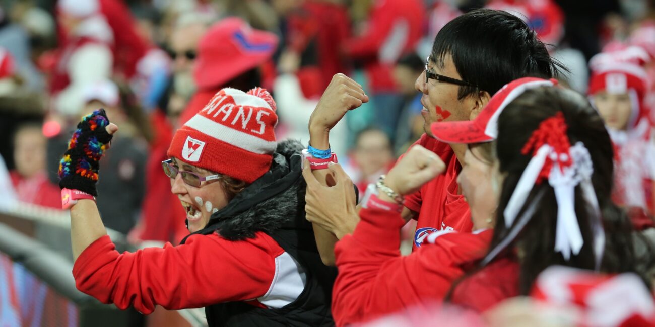 Sydney Swans fans wear heart monitoring wristbands as part of HCF Heart of the Swans digital marketing activation.