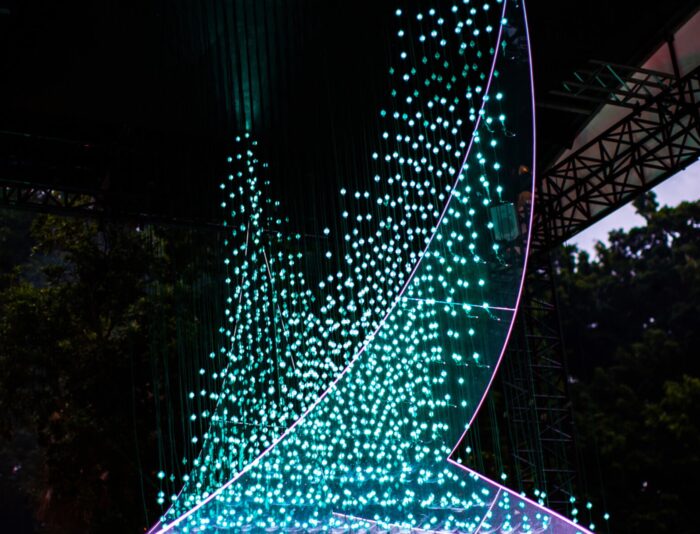 Thousands of coloured LED lights form the Cathay Pacific brushwing logo for Taking Flight light Installation.