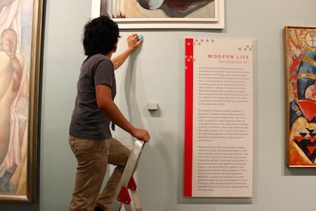 Man installs an iBeacon bluetooth beacon in the Brooklyn Museum.