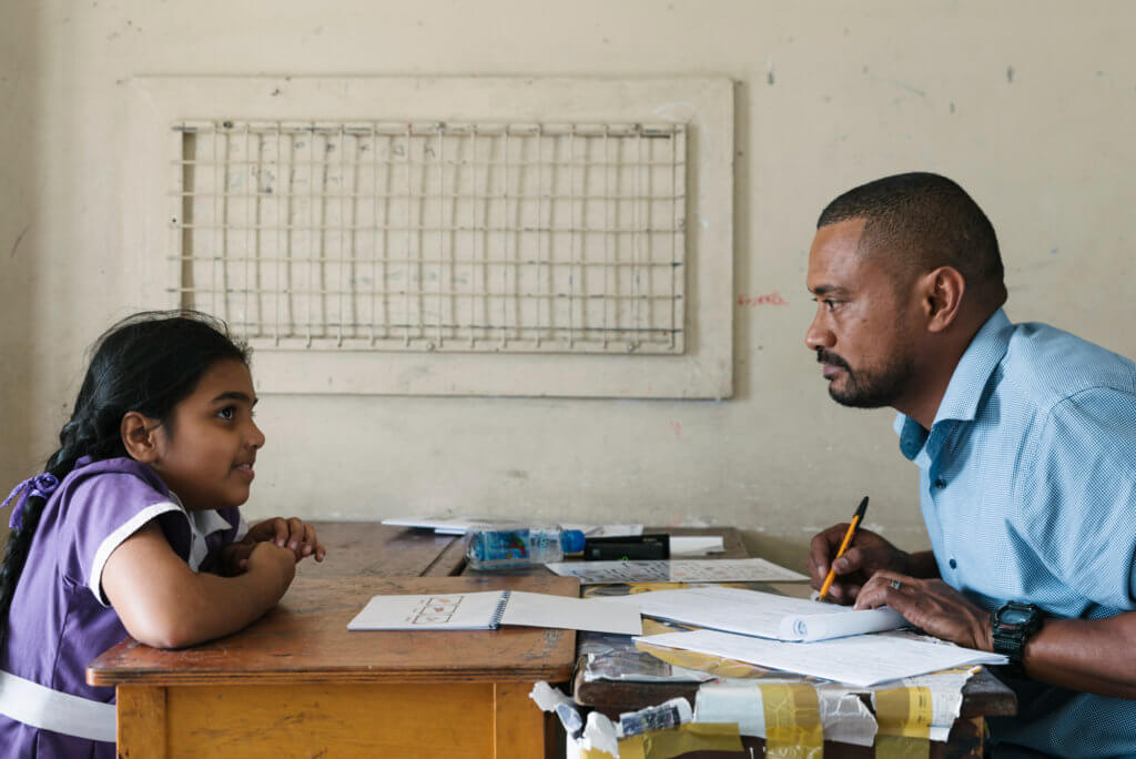 A member of the Beyond the Stars team conducts a child survey in Fiji.