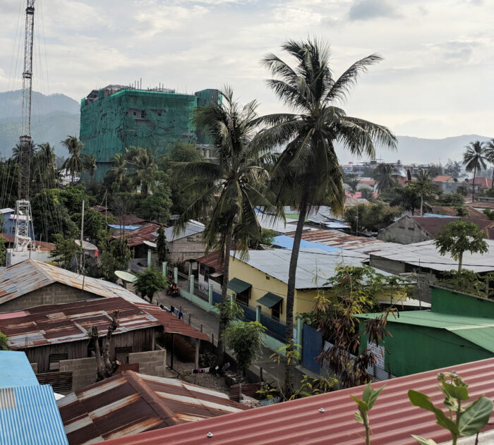 View from a rooftop looking out over houses in Dili, Timor-Leste.