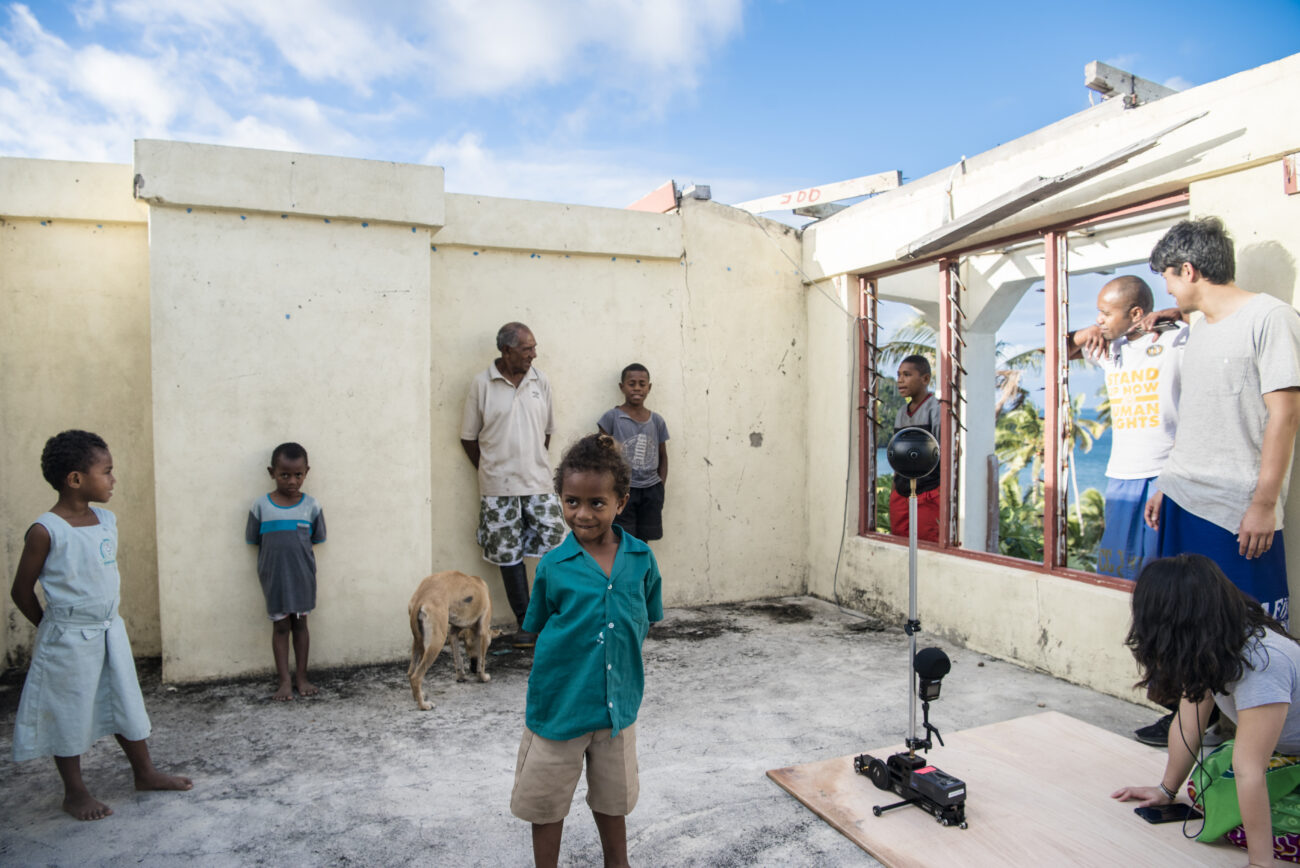 Fijian children wait behind the scenes of &#039;Our Home, Our People&#039; virtual reality project.