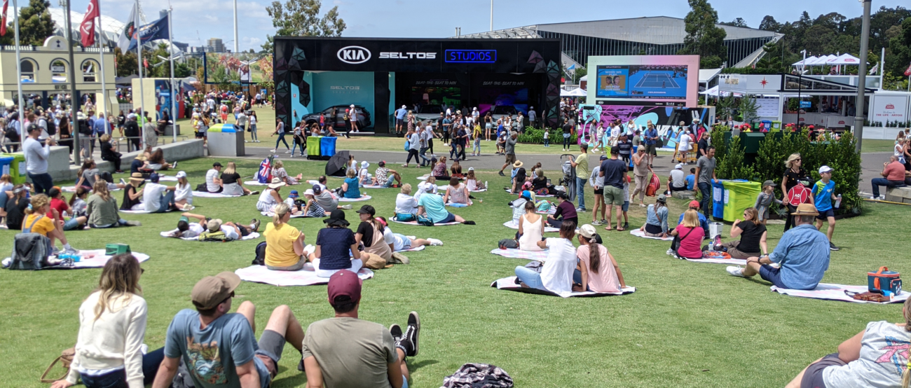 Crowds of tennis fans sit and look at the Kia Seltos Studio at the 2020 Australian Open in Melbourne.