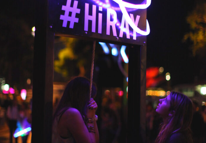 Women interact with experiential marketing activation RAY at Vivid Sydney.