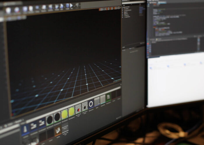 Screens show Unreal Engine as creative technology agency developers work behind the scenes on virtual reality 3D scene reconstruction.