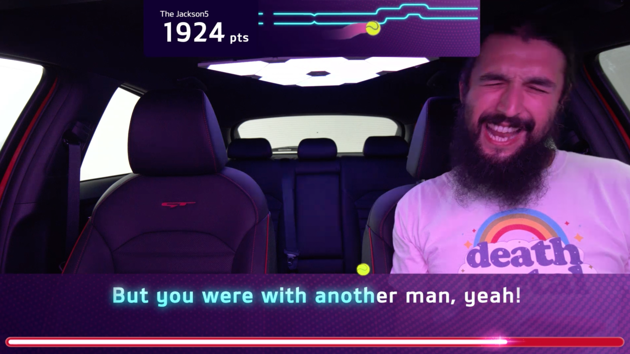 Screenshot of the augmented reality performance scoring and in-car user interface for Kia Caraoke Studio.