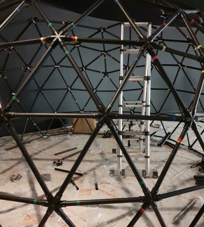 Close up of Take Me There geodesic dome during construction at vivo Lab concept store.