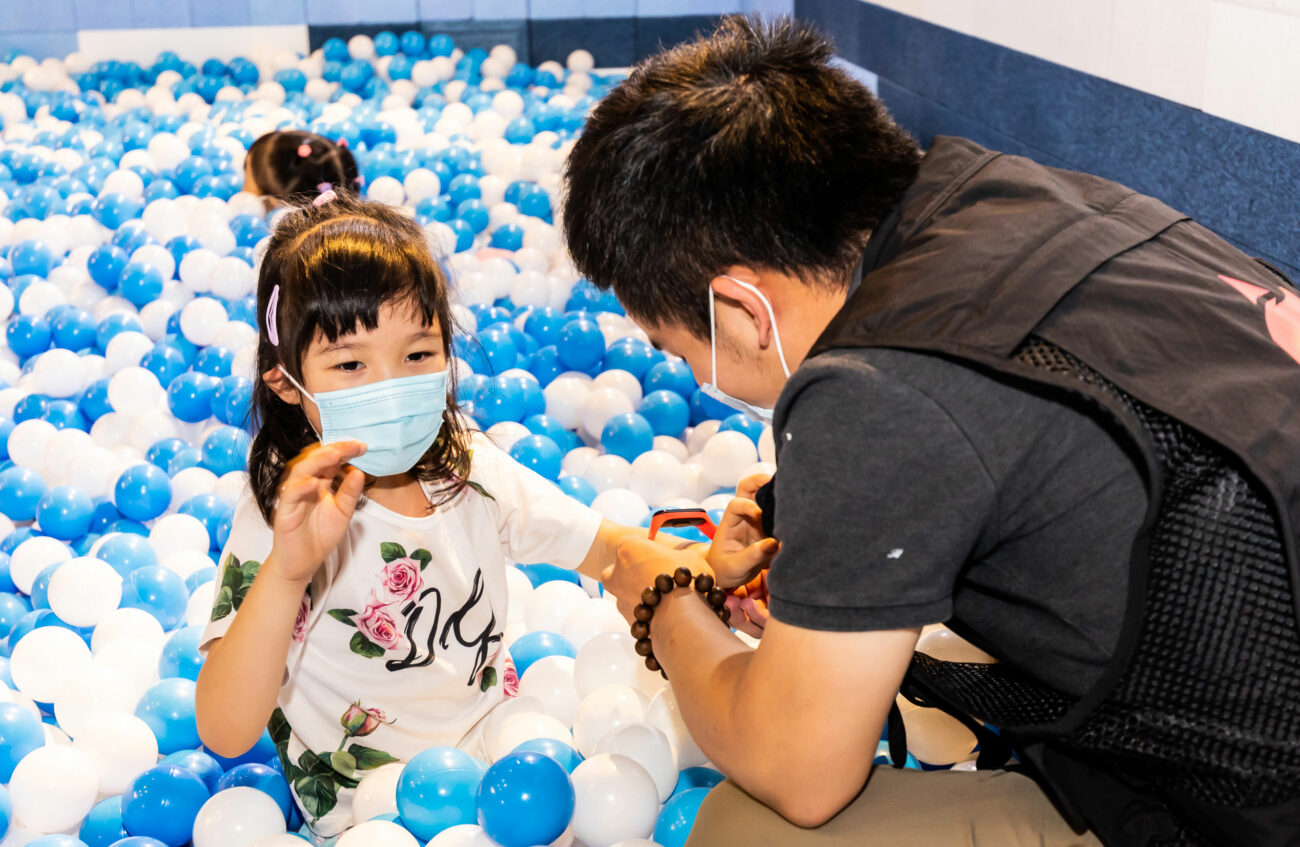 Parent and child play in a highly tactile ball pit as part of Super Wings: Fly With Me interactive exhibition.