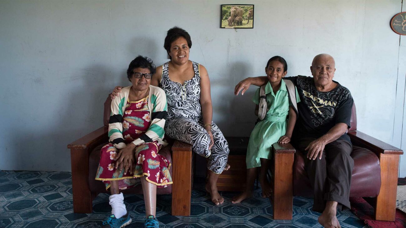 A Fijian family participating in Beyond the Stars sits for a portrait at their home in Nausori, Fiji.