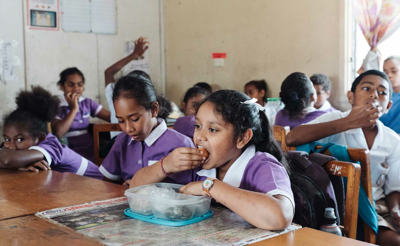 Children who participated in the Beyond the Stars pilot program eat lunch together at school.