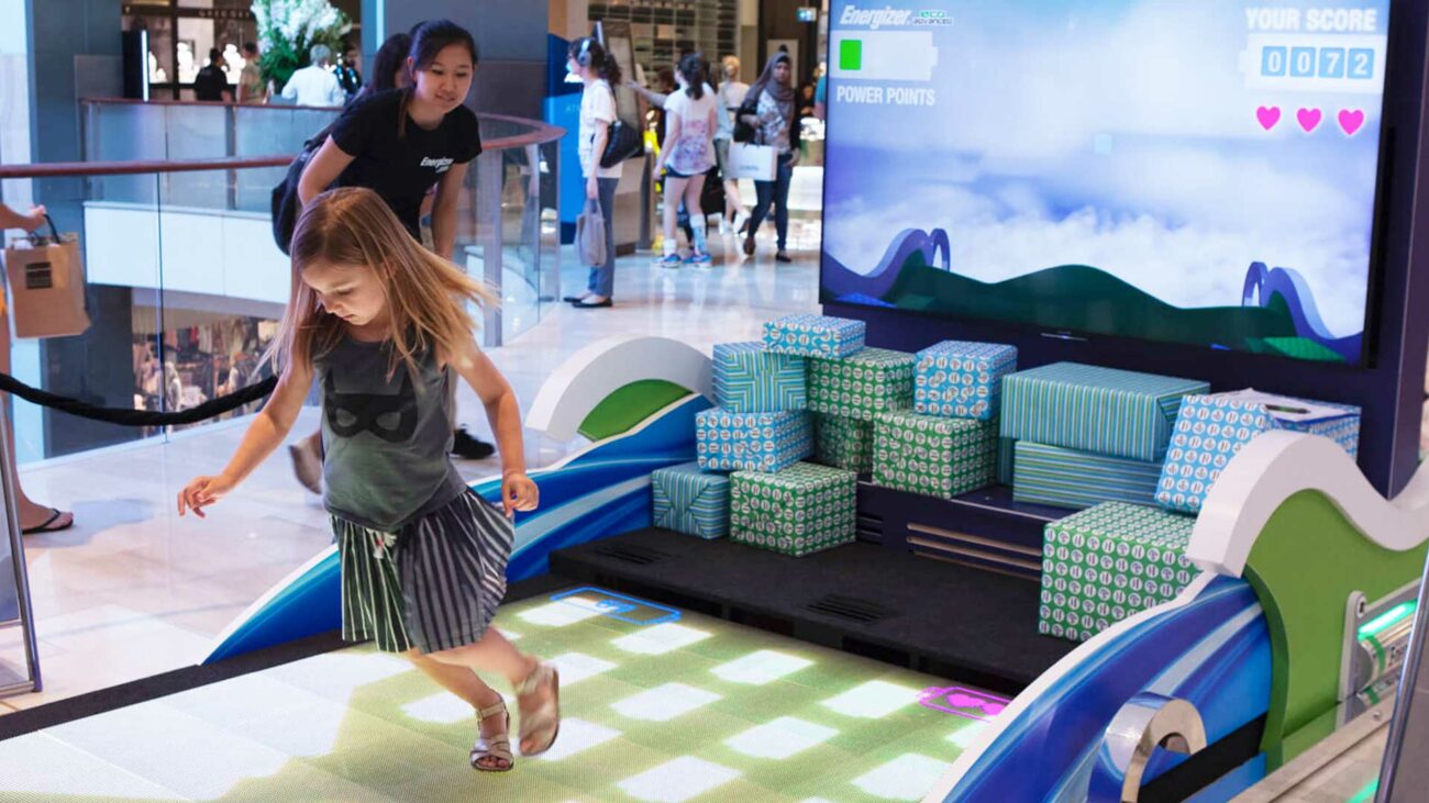 Girl playing on Real Time Interactive Floor.