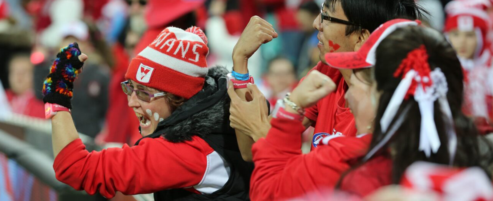 Fans at AFL game.