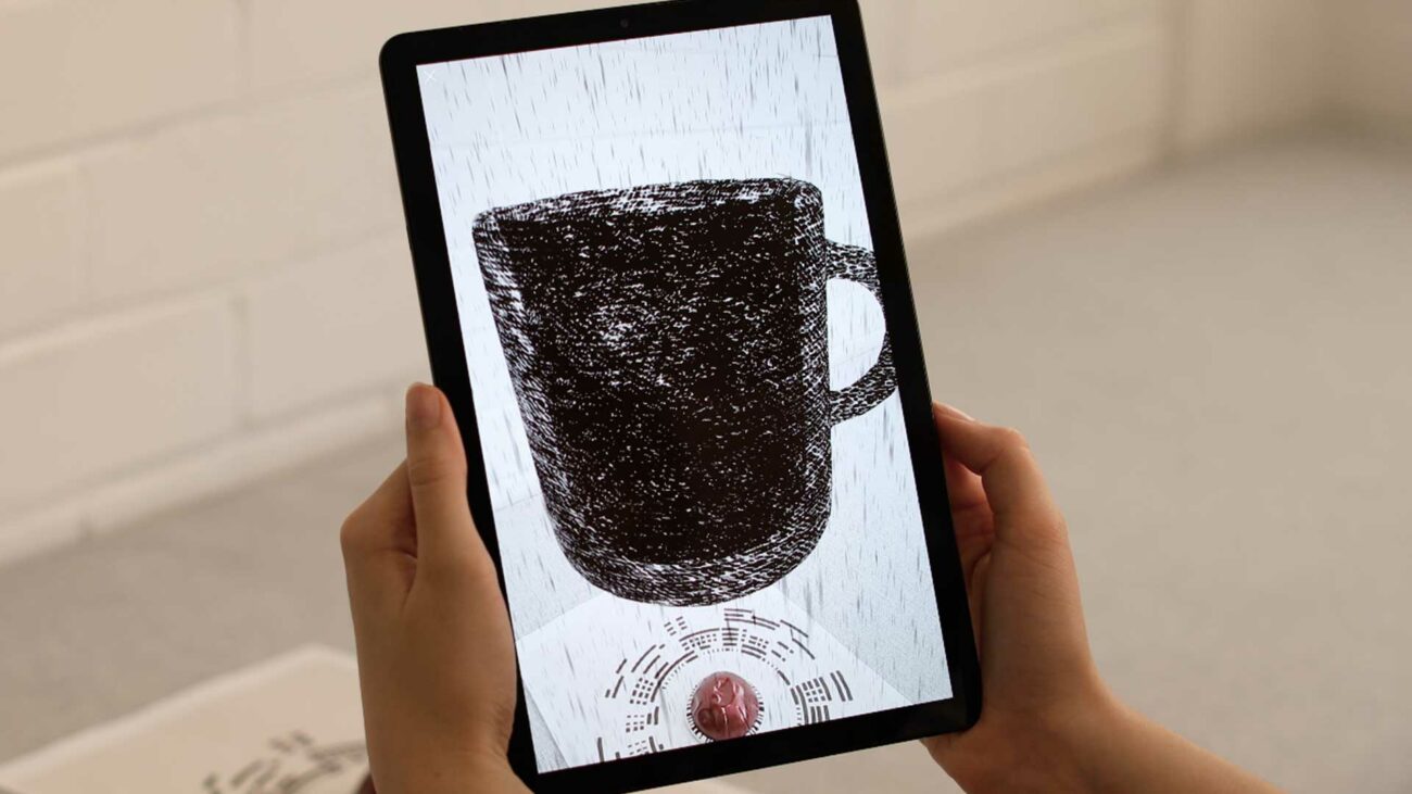 Tablet showing Nespresso AR augmented reality experience.