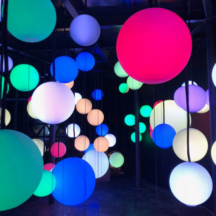 Collection of floating blue orbs make up Touching Photons light installation in the vivo Lab concept store.