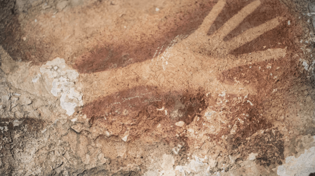 Ancient human handprints on cave walls among our earliest signs of creativity.