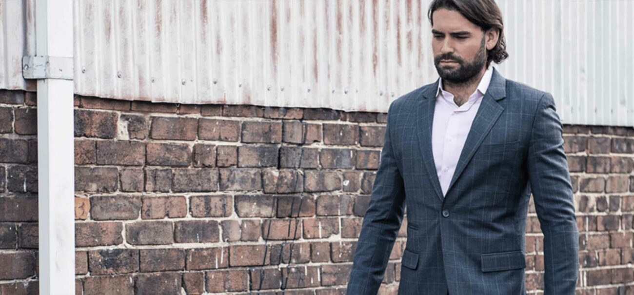 Slick male model wearing Brownmen&Co suit.