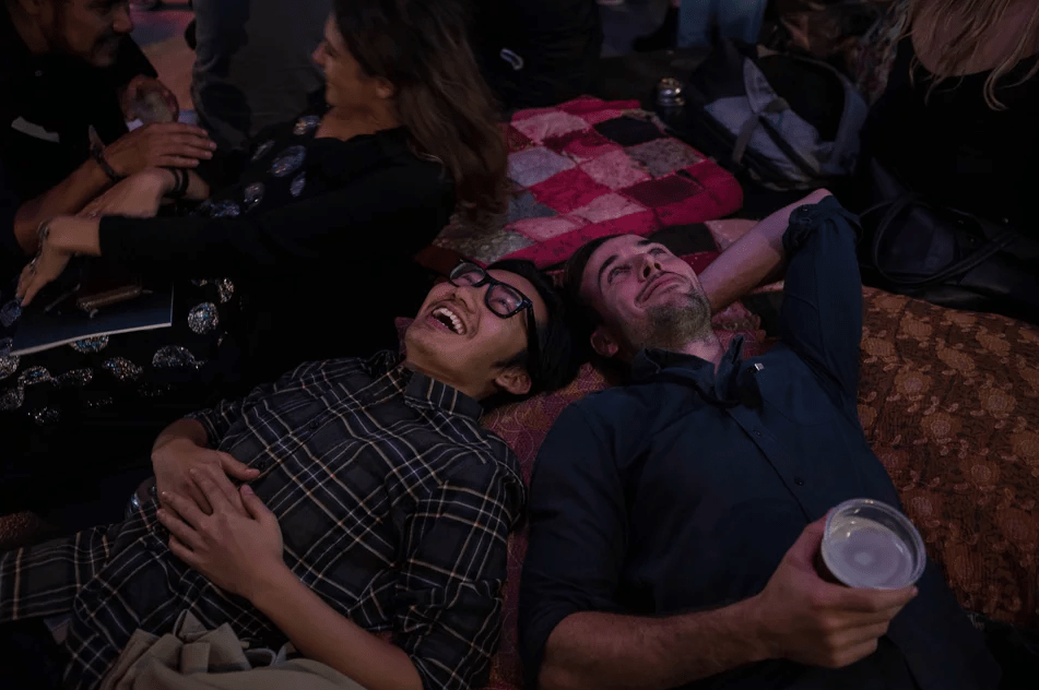 Users laying on the floor watching the Interactive Kaleidoscope Chandelier.