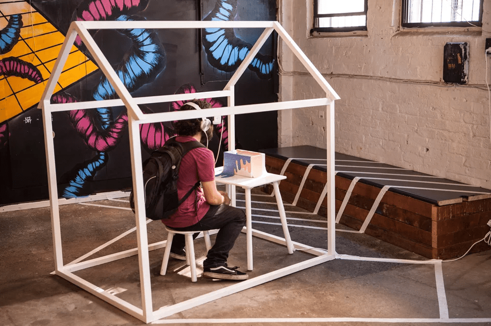 User participating inside a Virtual Reality dollhouse.